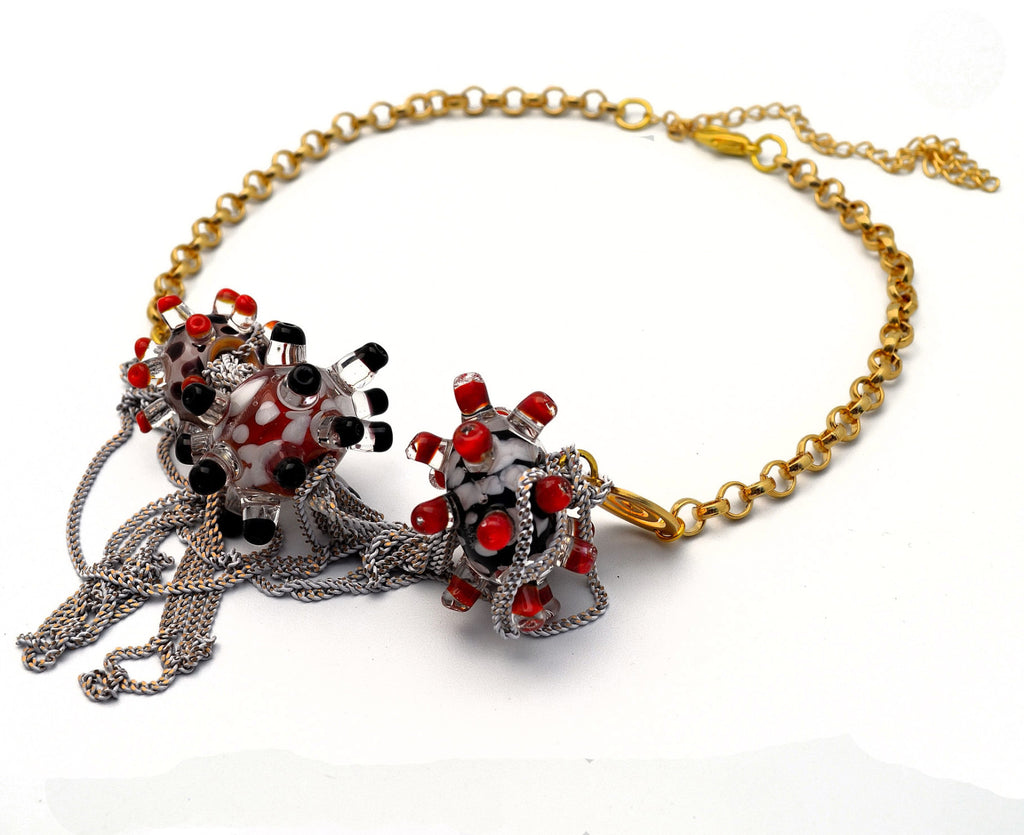 Day at the beach. Murano handmade glass art with a high quality gold plated chain.