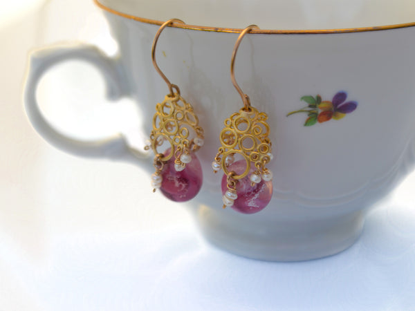 Vintage style pink designer earrings.