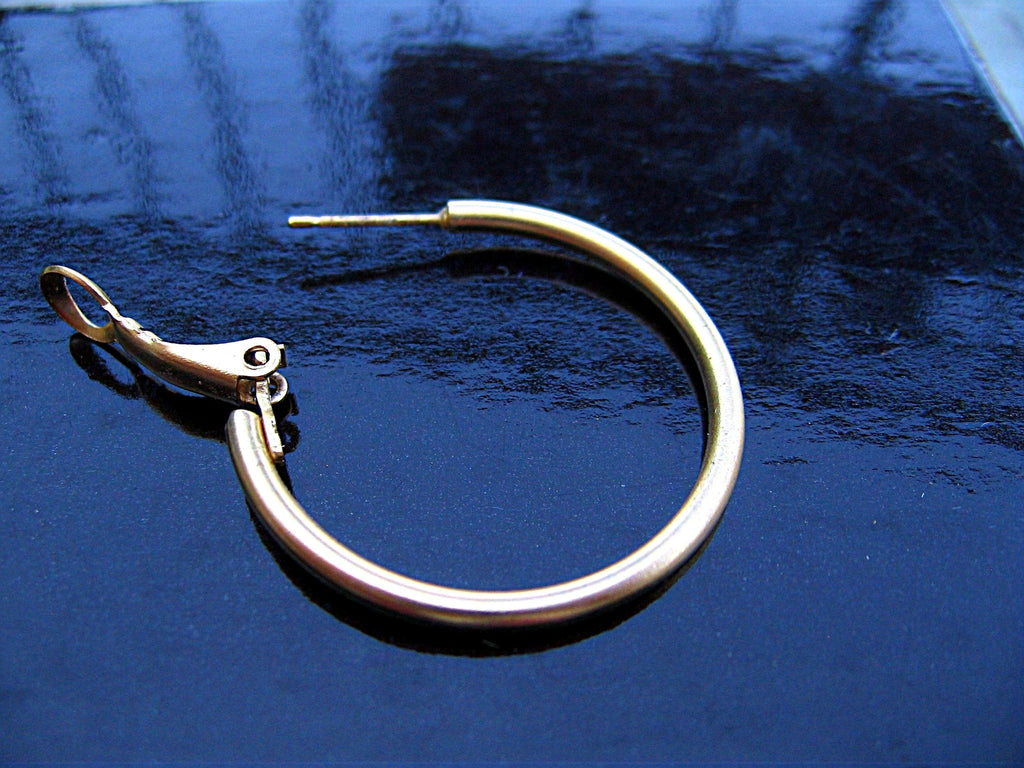 HOOPLA.  A pair of glass hoop earrings
