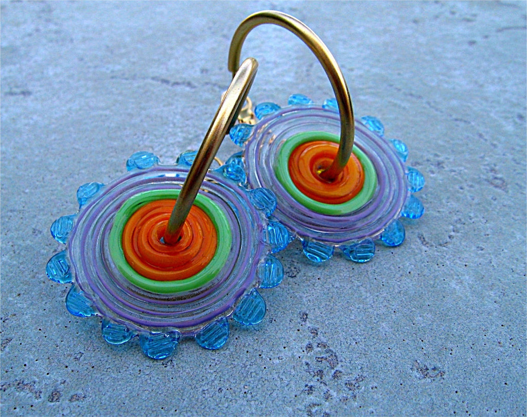 HOOPLA.  A pair of glass hoop earrings