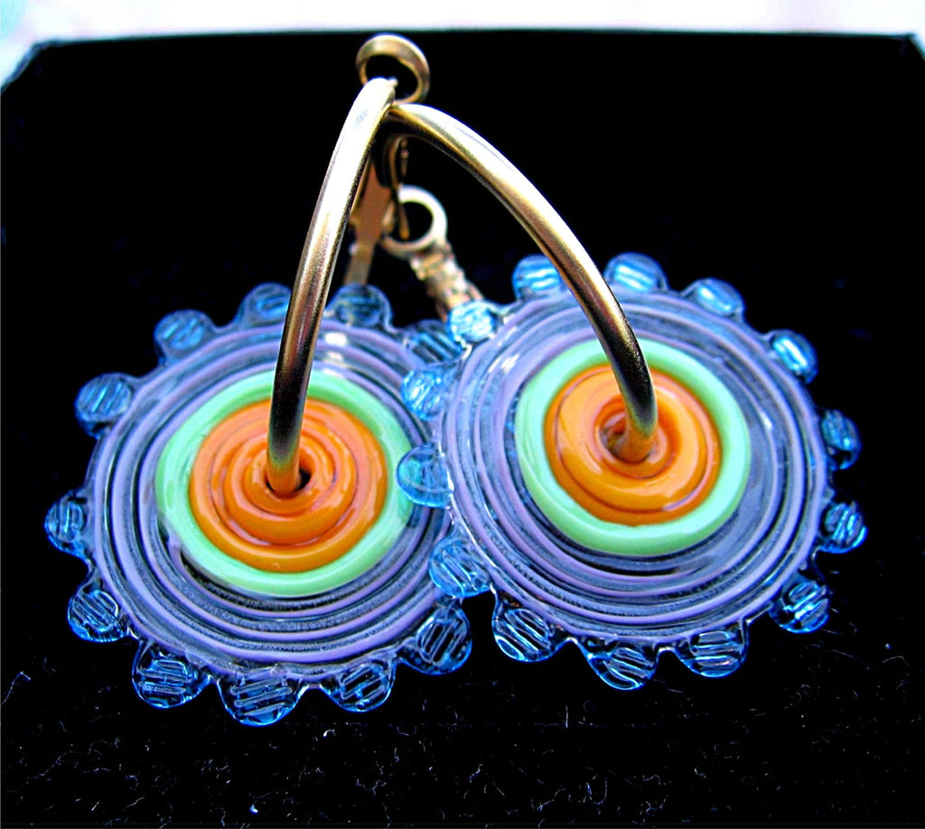 HOOPLA.  A pair of glass hoop earrings