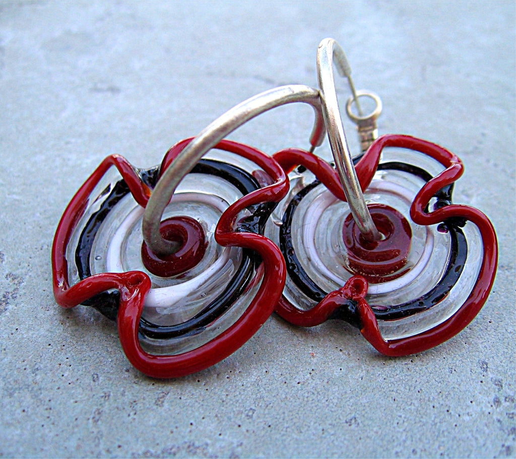 HOOPLA.  A pair of glass hoop earrings