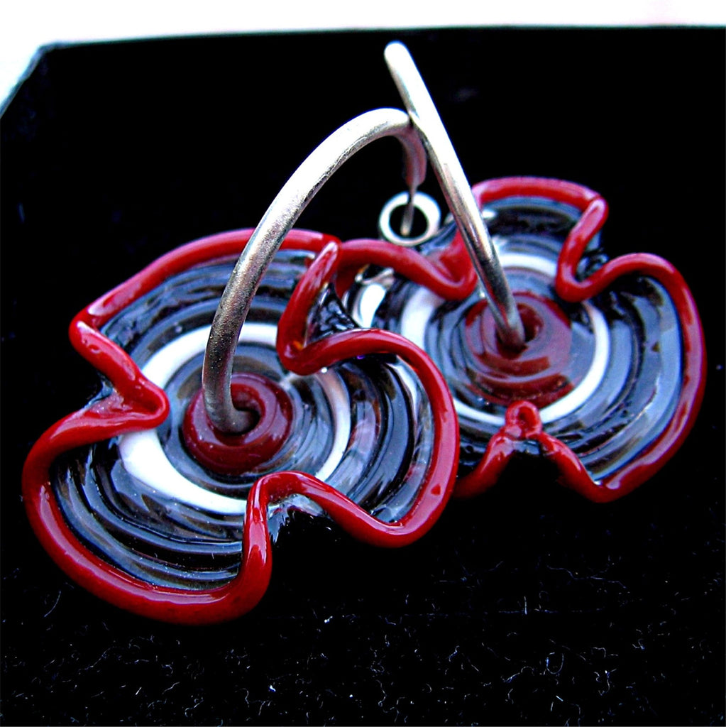 HOOPLA.  A pair of glass hoop earrings