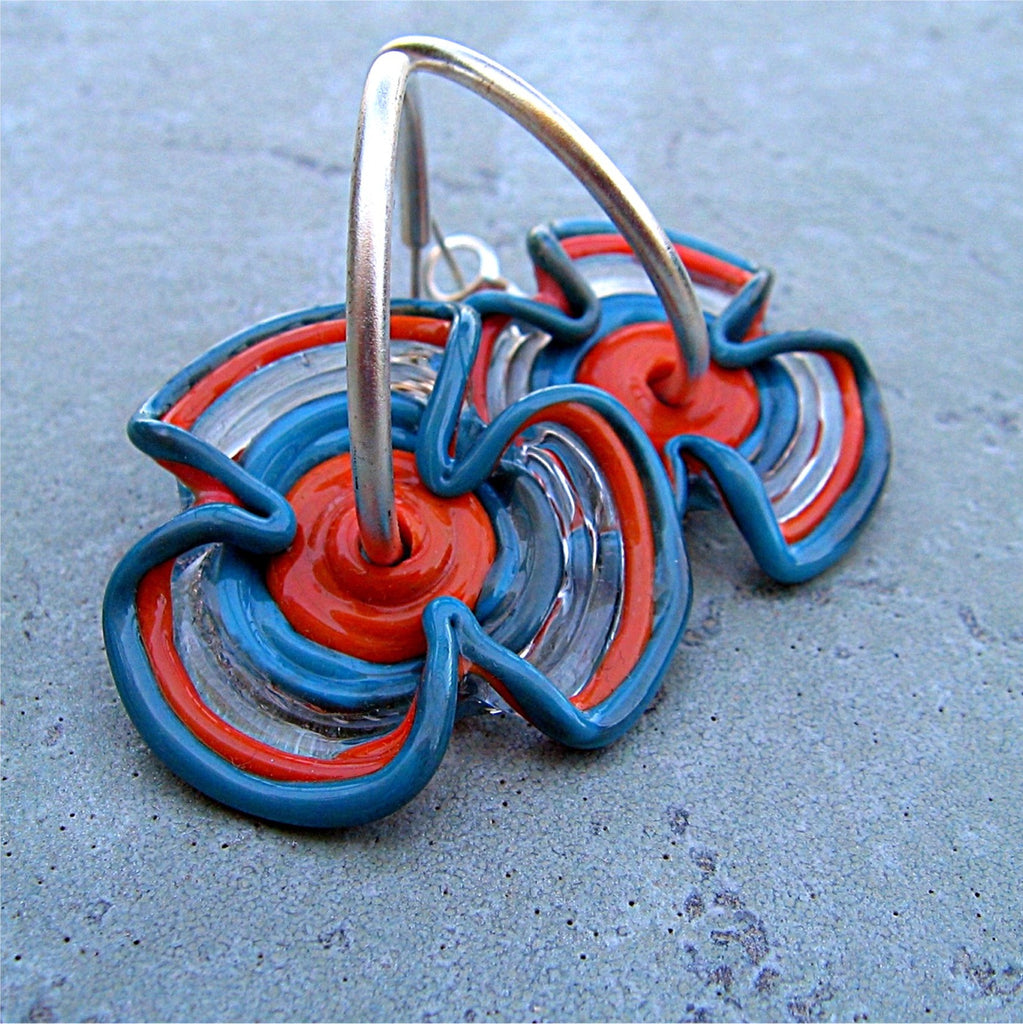 HOOPLA.  A pair of glass hoop earrings