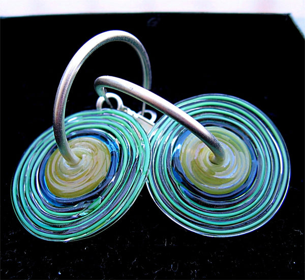 HOOPLA.  A pair of glass hoop earrings