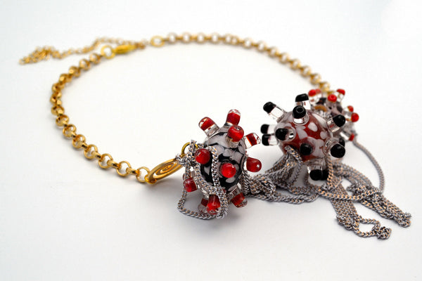 Day at the beach. Murano handmade glass art with a high quality gold plated chain.