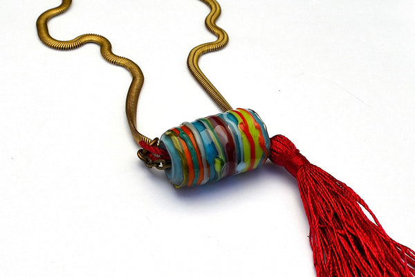 Carnavero Moreno handmade glass pendant. Silk tassel